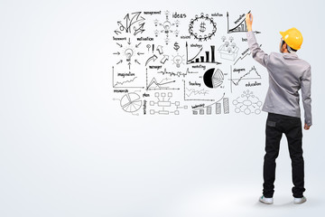 Obraz premium Engineer drawing business plan concept idea on whiteboard.