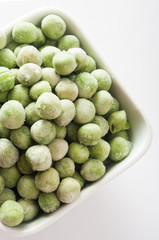 frozen peas close up in white background