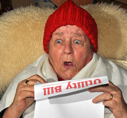 Elderly Woman Reading Utility Bill