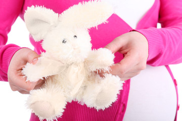 Pretty toy rabbit with unreal design and belly of pregnant woman