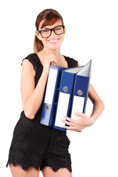 Smiling girl in big glasses holds three large blue folders
