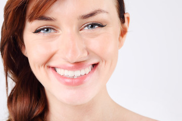 Close-up of beautiful smiling young and pretty caucasian woman.