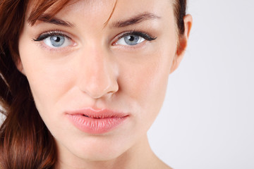 Close-up of beautiful melancholy pretty caucasian woman
