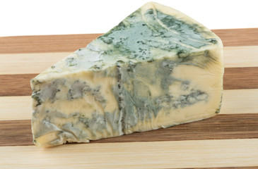 Wedge of soft blue cheese, isolated on white