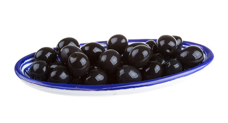 Olives black watered with olive oil in a bowl isolated on a whit