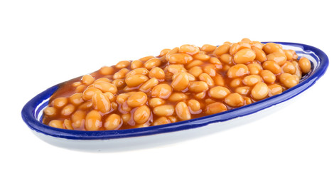Marinated haricot beans in tomato sauce with shallots on a plate