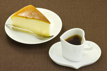 cheese cake and coffee on the table