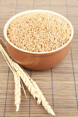Brown bowl full of wheat bran
