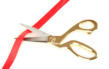 Cutting red ribbon isolated on white