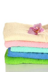 Obraz na płótnie Canvas Stack of towels with fragrant flower isolated on white
