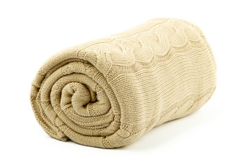 rolled beige blanket