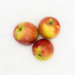 Red apples in the snow