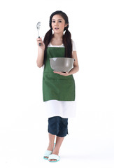 Young housewife holding a bowl and a spaghetti scoop