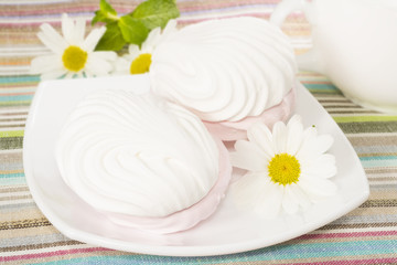 Air marshmallows on a plate, closeup