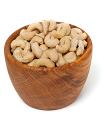 cashew nuts in a bowl isolated on white background
