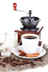 White cup of Turkish coffee with milk and coffee mill isolated