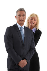 Blonde woman behind  man in a suit