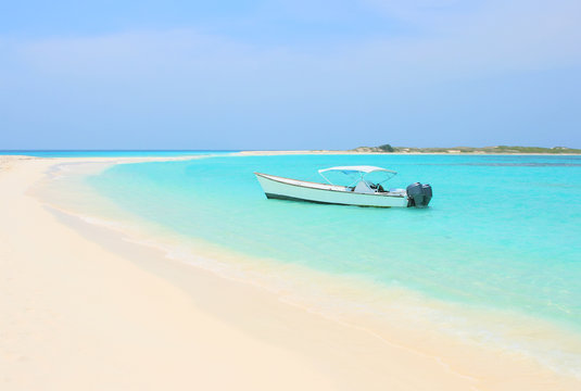 Boat at the tropical beach of Los Roques