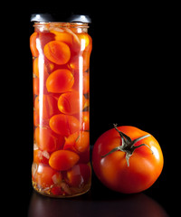 canned tomatoes in glass jars
