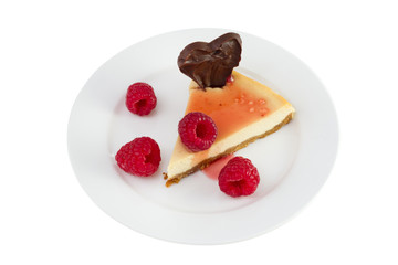 cheesecake with raspberries on the plate on white background