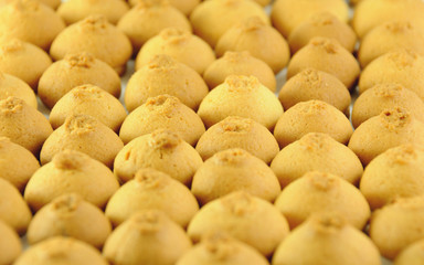 Little lady biscuits on a wooden board