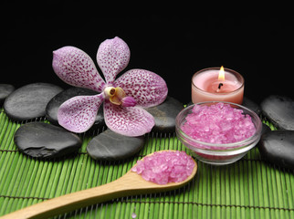 orchid and salt in bowl and candle on n mat