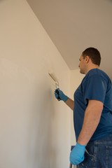 Painter painting wall © Globalphotogroup