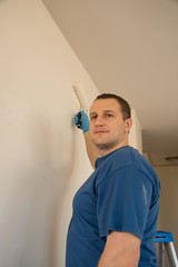 Painter painting wall © Globalphotogroup