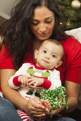 Ethnic Woman With Her Mixed Race Baby Christmas Portrait
