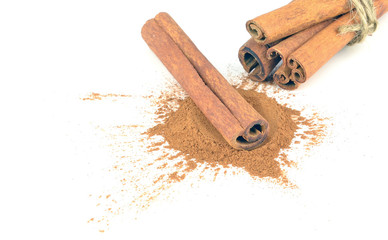 Cinnamon sticks and ground cinnamon with copy space