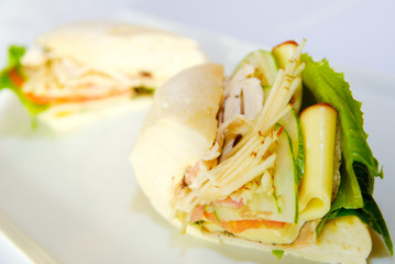 Sandwich with salmon and cucumbers on white bread