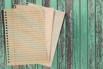 Naklejka na ściany i meble Paper texture - brown paper sheet on wood background