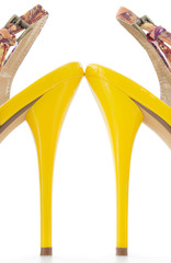 Yellow women stiletto shoes high heels, isolated .
