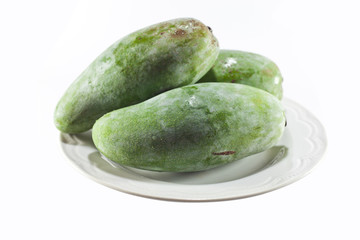 green mango on dish