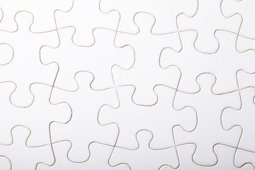 Jigsaw puzzle with blank white pieces