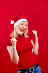 pretty blonde woman wearing a christmas hat having fun