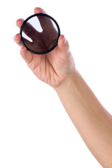 Fototapeta premium Hand holding polarization filter