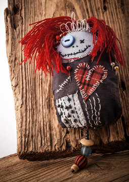 Handmade Pincushion "voodoo doll" on wooden background