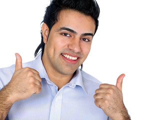 A smiling man showing thumb up sign