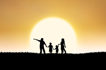 Fototapeta na wymiar Family silhouette on sunset