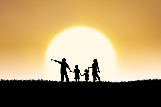 Family silhouette on sunset