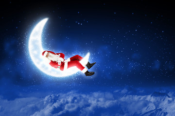 photo of santa claus sitting on the moon