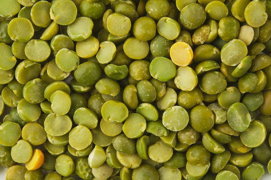 Dry split green peas texture background