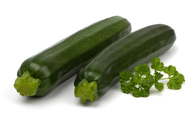 Two fresh vegetable zucchini isolated on white background.