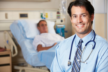 Portrait Of Doctor With Patient In Background