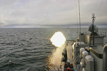 Military warship gun shooting