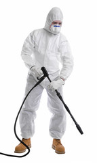 man in full protective clothing using pressure washer