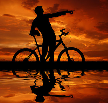mountain biker silhouette in sunrise