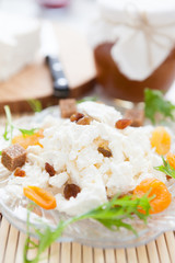 sweet curds on a plate with dried fruit
