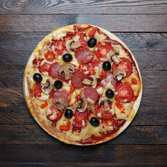 Pizza on wooden table